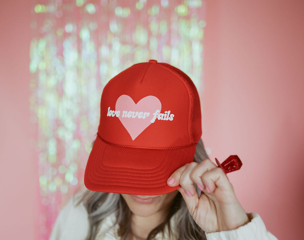 Love Never Fails | Adult Trucker Hat-Hats-Sister Shirts-Sister Shirts, Cute & Custom Tees for Mama & Littles in Trussville, Alabama.
